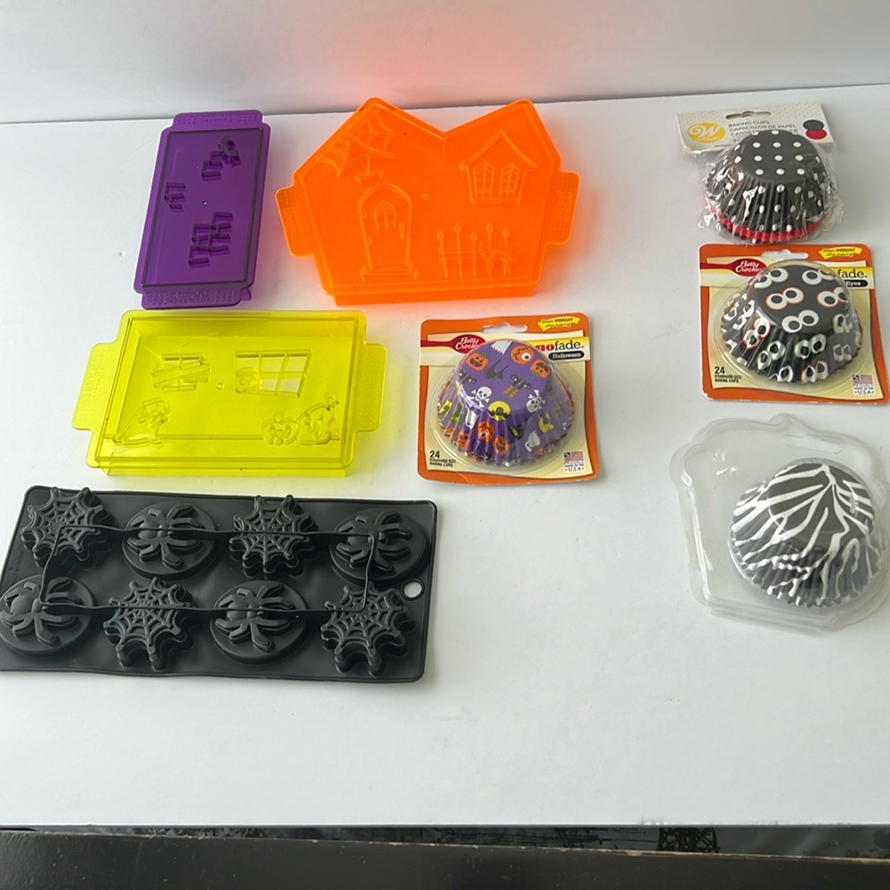 Set of three cookie cutter, one candy mold and 4 packages baking cups